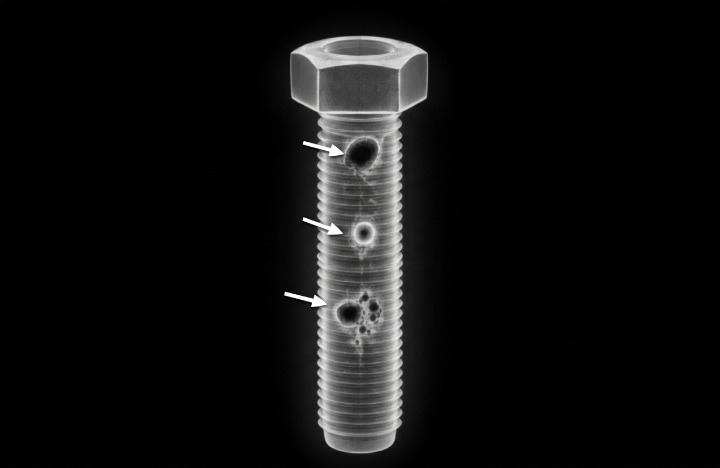 X-ray image of a bolt showing inclusions, voids, or internal density issues.